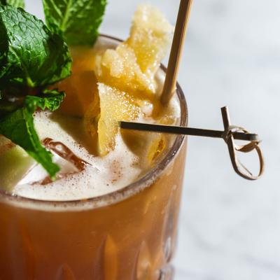 Cocktail with bourbon, ginger, lemon, and fernet branca.