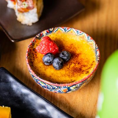Creme brulee topped with berries.