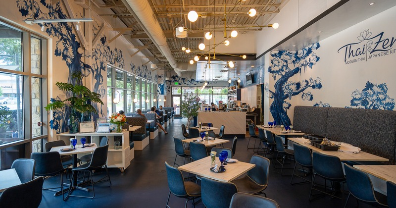 A stylish, modern and spacious restaurant interior, dining area with set tables