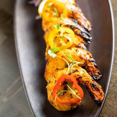 Grilled prawns marinated in lemon and herbs