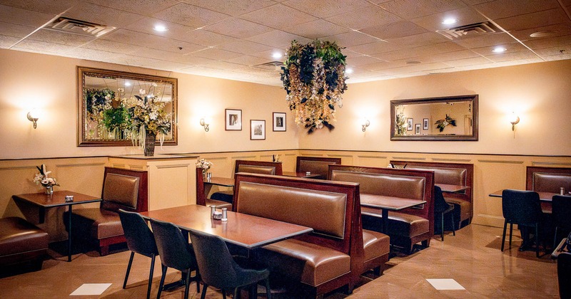 Dining area, tables, chairs  and restaurant booths with mirrors on the wall different angle