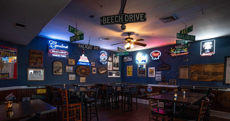 Tables with bar stools, space with decorated walls
