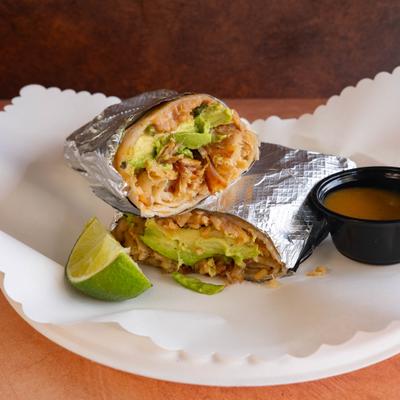 Chicken burrito with bacon and avocado.