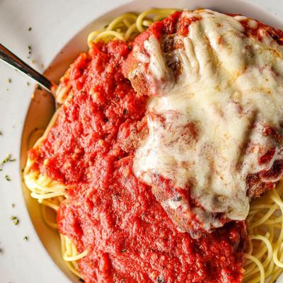 Chicken parmigiana with spaghetti.