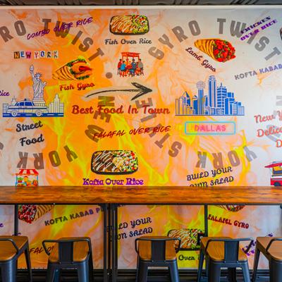 Interior featuring a vibrant wall mural and counter seating.
