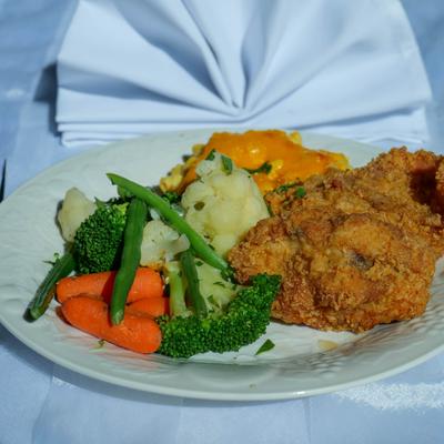 Southern fried chicken with sides, closeup.