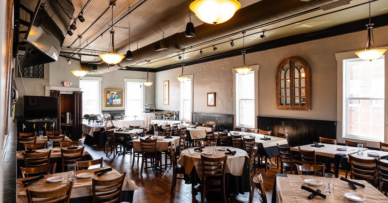 Interior, tables and chairs in spacious dining area