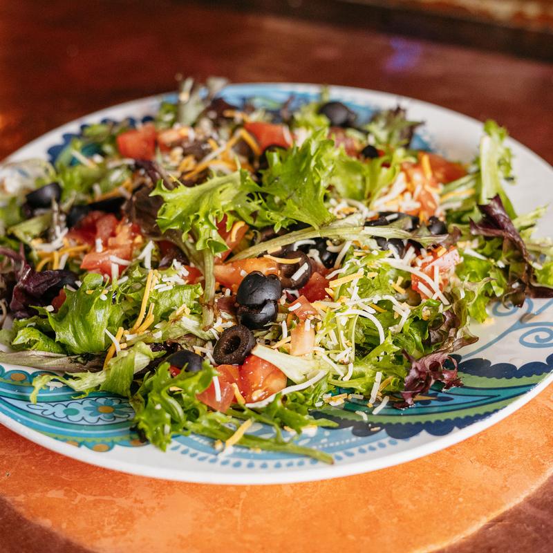 tomatoes, black olives + shredded jack & cheddar cheese + choice of homemade dressing: ranch (spicy or regular), bleu cheese, thousand island, honey mustard, italian or russian +fried or grilled chicken $3 photo