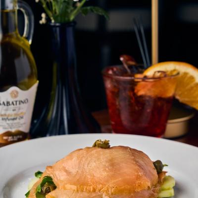 Salmon fillet over vegetables.