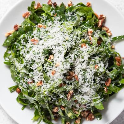 Collard green salad with toasted pecans and fresh grated Parmesan.