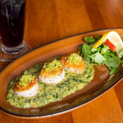 Seared scallops, with spinach butter and toasted lemon scented breadcrumbs