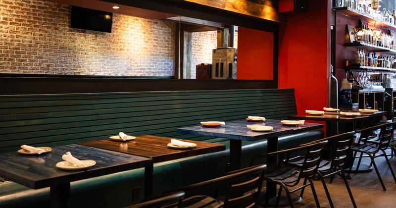 Inside, long banquette seating area, dining tables