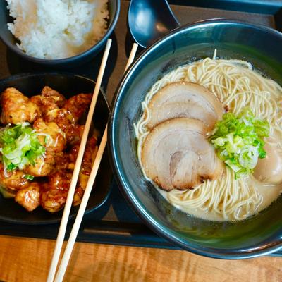 Japanese ramen set meal with chashu pork, green onions, and fried chicken.