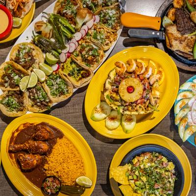 Selected Mexican dishes on a table, top view.