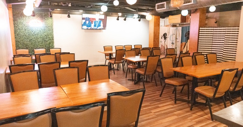 Inside, seating area with TV on the wall