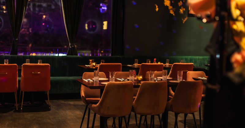 Modern restaurant interior space, dining area with set tables