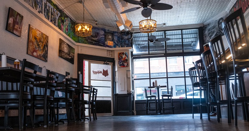 Interior dining area, ceiling fans, tables and chairs