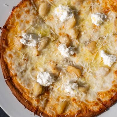 Bianca pizza topped with roasted garlic, parmesan, mozzarella and ricotta.