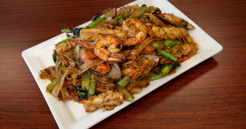 Stir fried noodles with shrimp, eggs, carrots, and Chinese broccoli