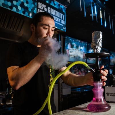 A person enjoying hookah.