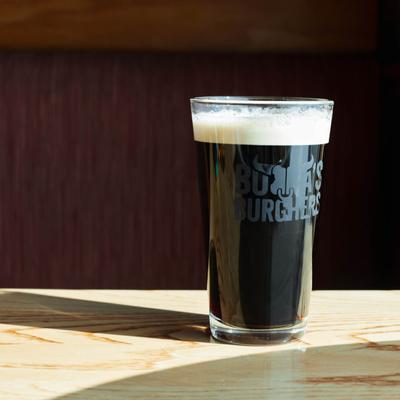 A glass of stout beer.
