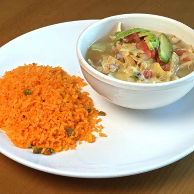 Tortilla soup served with rice.