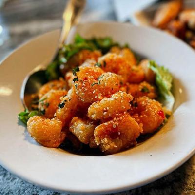 Bang Bang Shrimp tossed in a Thai chili sauce, served over lettuce.
