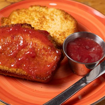 Breakfast side of Grilled Cornbread and sweet jam.