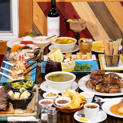 Variety of dishes and drinks on a table.