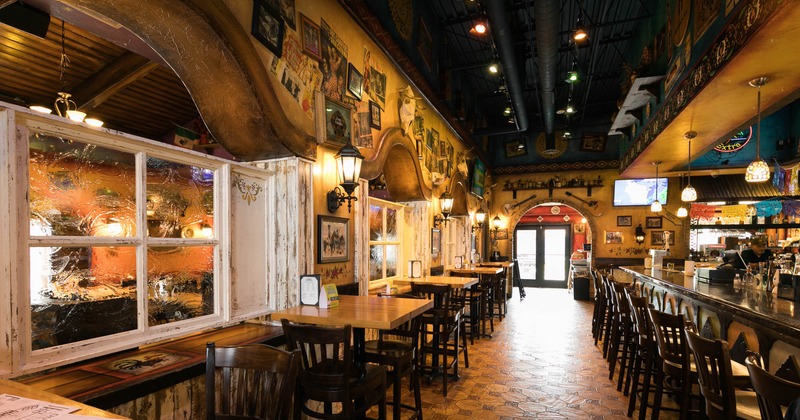 Interior, tables and chairs across from the bar