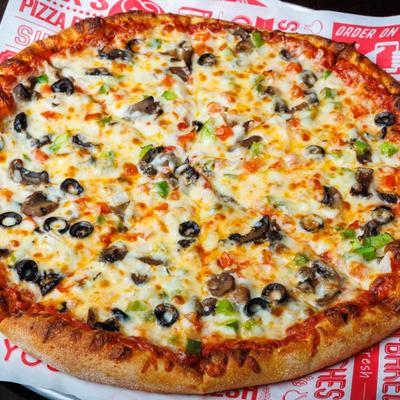 Veggie pizza with olives, peppers, and melted cheese.