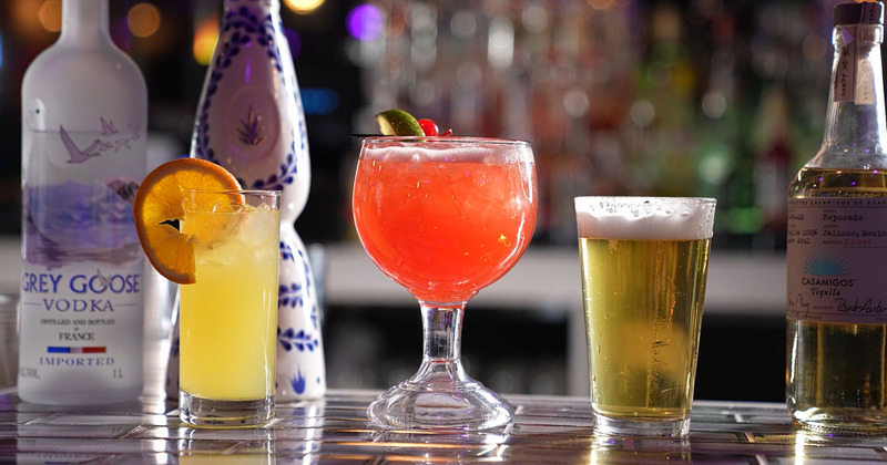 Glasses of cocktail and beer