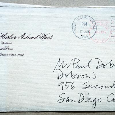 An envelope with a handwritten address and a postmark dated 17 July 1989