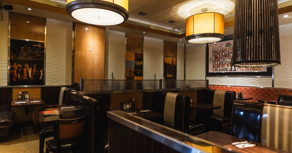 Interior of a retro-style diner with wooden decor and booth seating