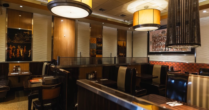 Interior of a retro-style diner with wooden decor and booth seating