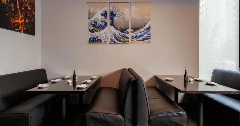 Interior, dining booths with tableware on tables, wall decor