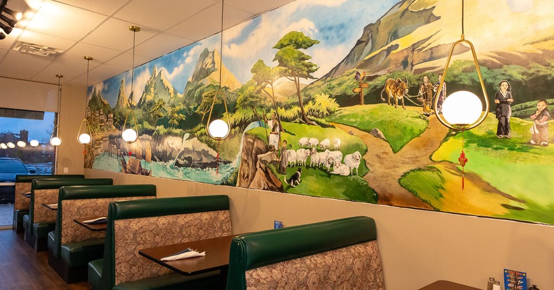 Interior, seating area with booths, wall mural