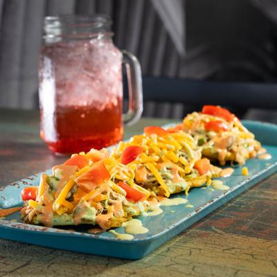 Stanley Peak Tostones served with a drink.