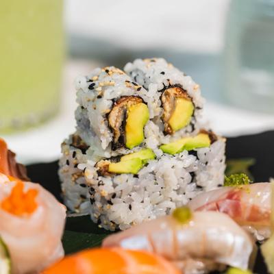 Close up of a roll on the sushi and sashimi combo platter.