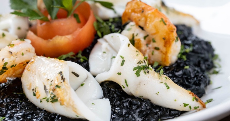 Black seafood risotto with shrimp and squid