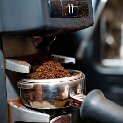Fresh coffee grounds in a portafilter.