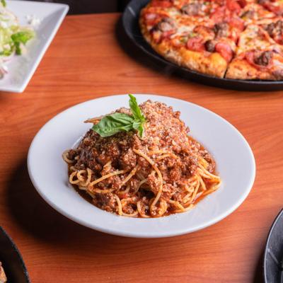 Spaghetti with tomato sauce, ground halal beef and fresg basil.