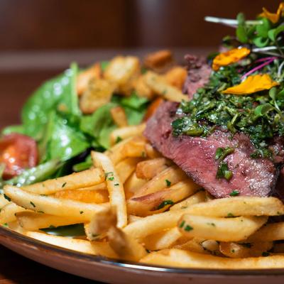 Steak and fries, with chimichurri sauce.