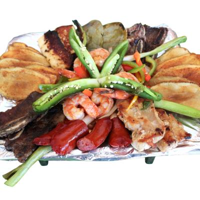 Mixed Parrillada with shrimp, chicken, ribs, sausage, cactus and garnishes.