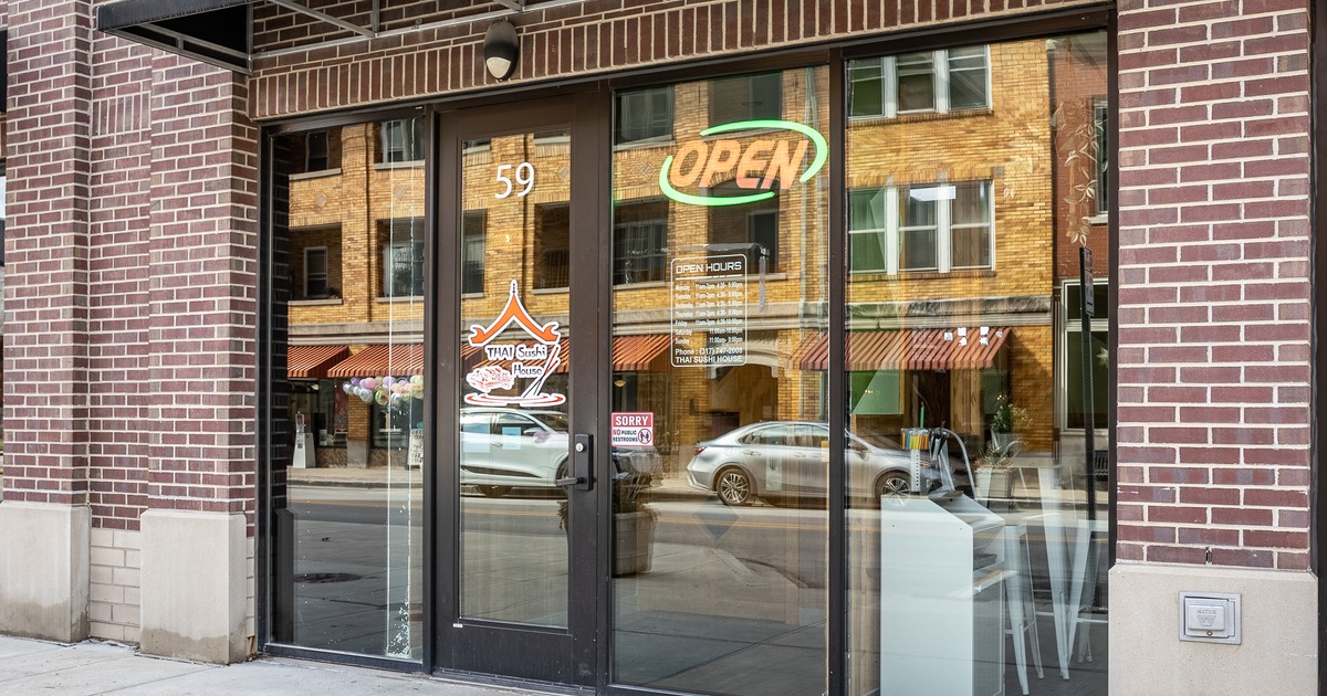 Exterior, front view to restaurant, entrance, sign above