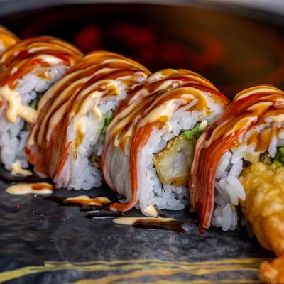 Shaggy Dog Roll with shrimp tempura and topping of spicy mayo and eel sauce.