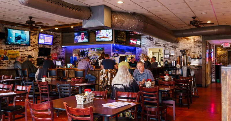 Interior, bar area, people, tables and chairs