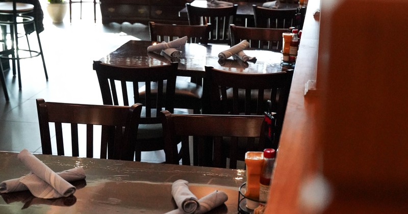 Interior of a restaurant with wooden tables and chairs