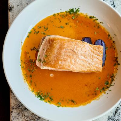 Seared salmon in tomato emulsion.