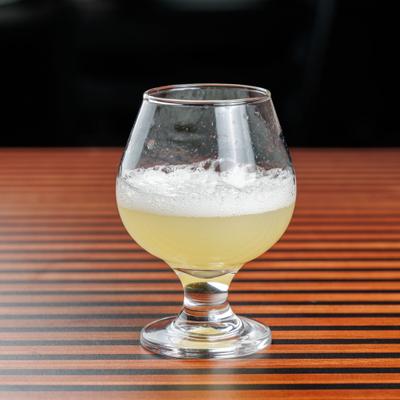 Foamy yellow cocktail.